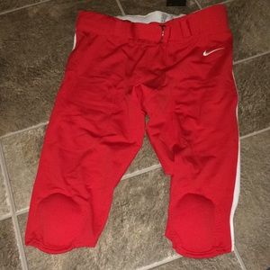 Red Nike football pants with pads